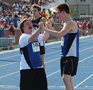 An Eastern High School athlete and Unified partner celebrate at the end of the Unified 100-meter dash at the 2016 KHSAA State Track and Field Meet.