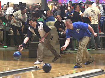 Two athletes competing at the State Bowling Tournament