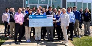 Bachman Subaru staff present a check for $34,594 to Special Olympics Kentucky