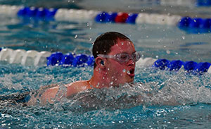 Swimmer comes up for air during the State Summer Games Swim Meet