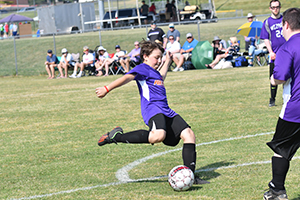 A player winds up for a shot in the State Soccer Tournament at the 2023 State Summer Games.