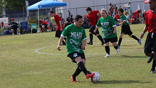 Soccer player kicking ball