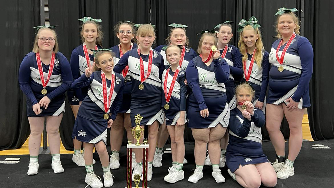 Murray Rockets Unified Cheerleaders with their medals and trophy.