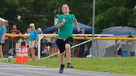 A Pulaski County runner sprints down the track at the State Summer Games