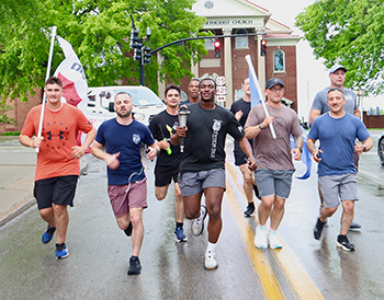 Law Enforcement Officers run with the Special Olympics Torch.