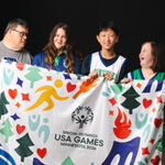 Athletes Holding a 2026 USA Games flag