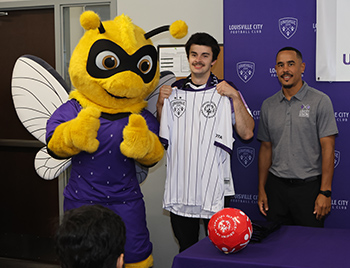 Garrett Nason with Sting and Louisville City FC and Racing Foundation Executive Director George Davis IV. 