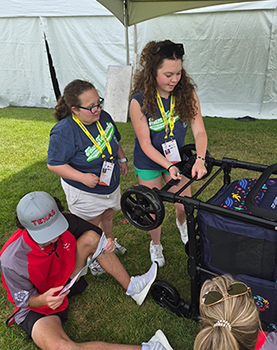 Olivia Pruitt and Mya Hetler building a playpen at the Young Athletes Festival.