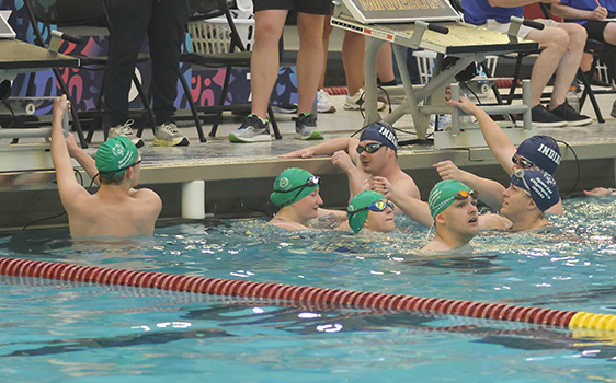 A group of swimmers in the pool