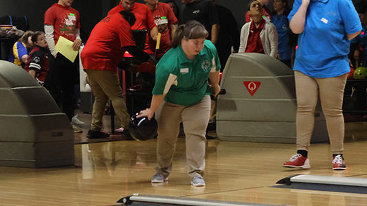 Bowler rolling a ball.