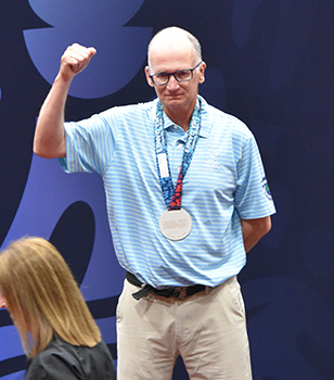 Chris Revay on the medal stand at the 2026 USA Games.